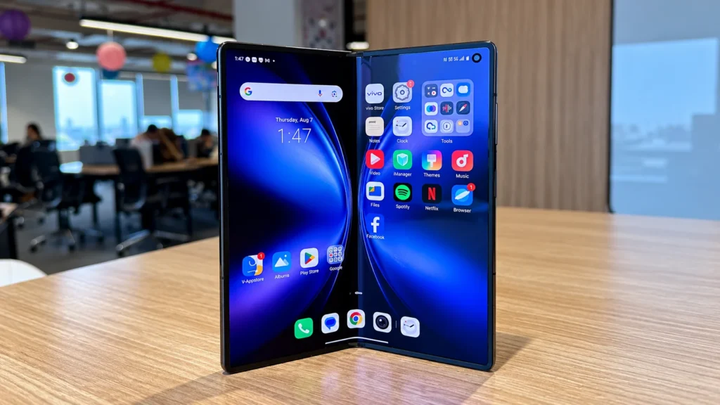Vivo X Fold 6 foldable smartphone opened on a table showing its dual AMOLED displays